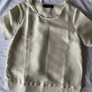 Beautiful lined cream top.  Leather detail at the waist with a gold zipper